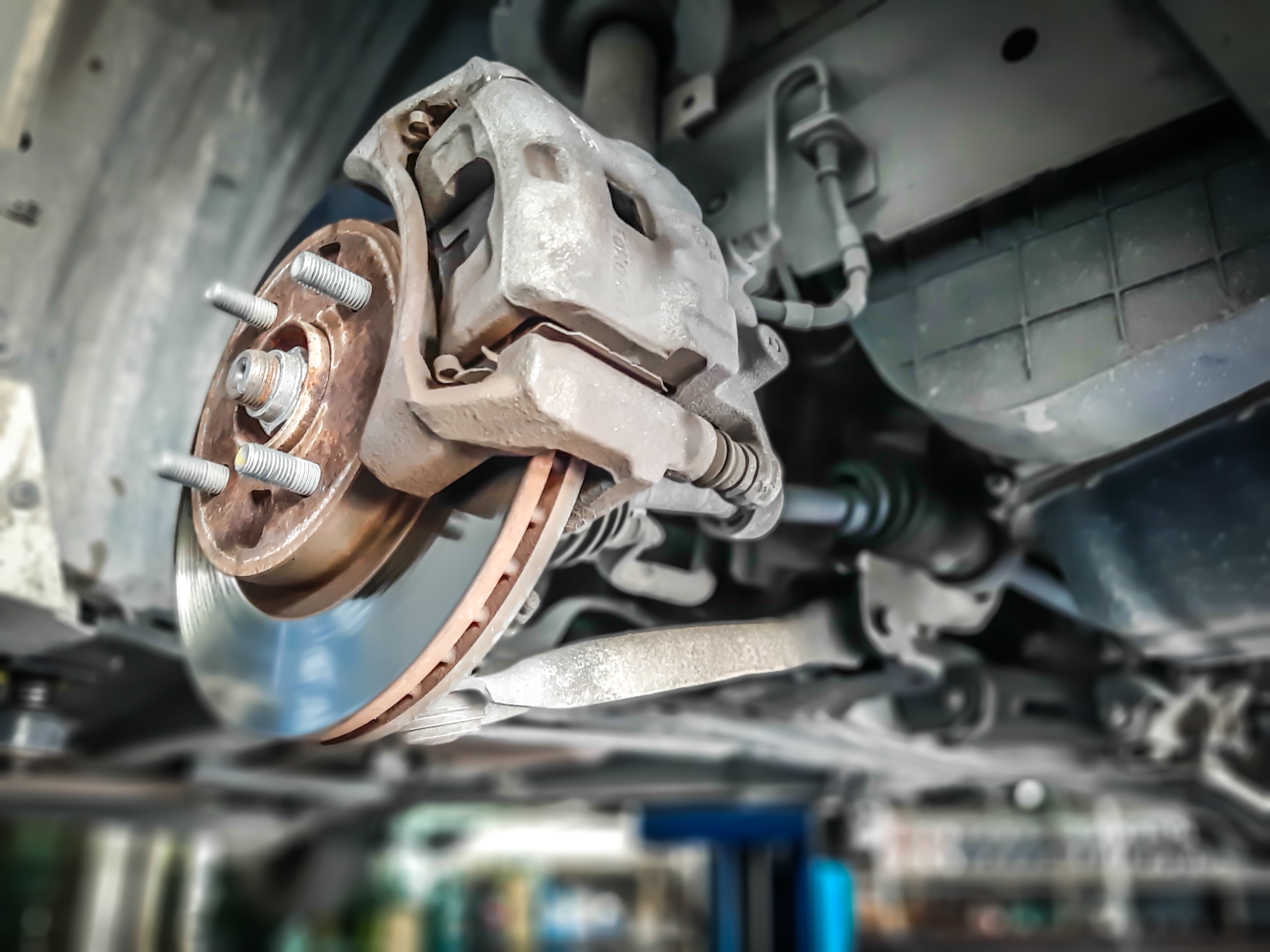 Car take wheel off show drum brake assembly. changing tire. Car take wheel off show drum brake assembly. changing tire.